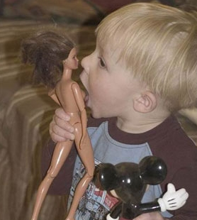 Seriously, does this kid look like he cares what Barbie looks like in the box?